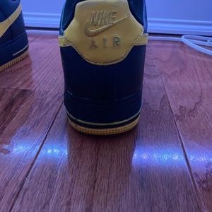 Black and yellow Air Force 1’s